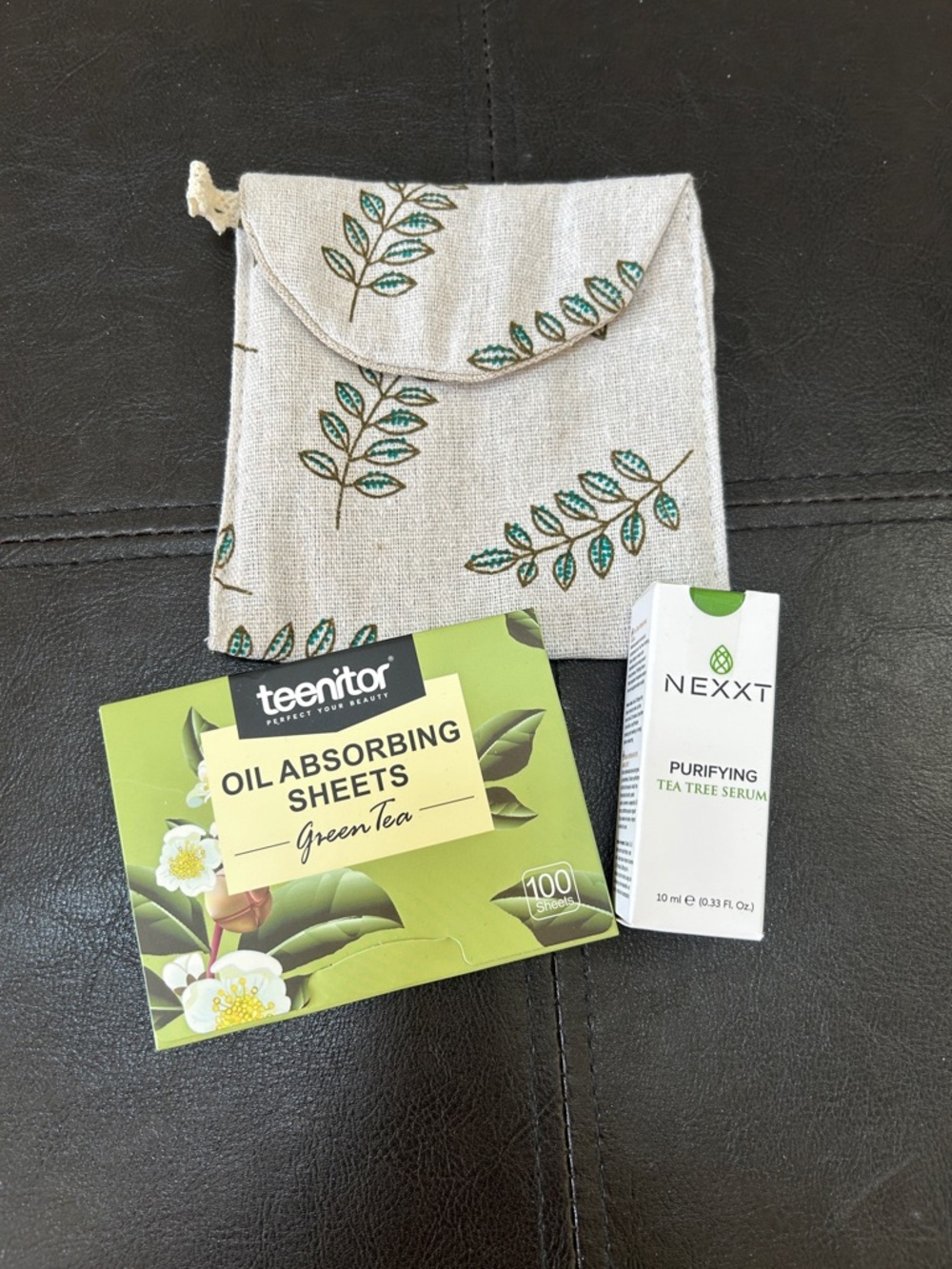 Bundle ft. NIB Nexxt Purifying Tea Tree Serum, oil blotting sheets and small bag